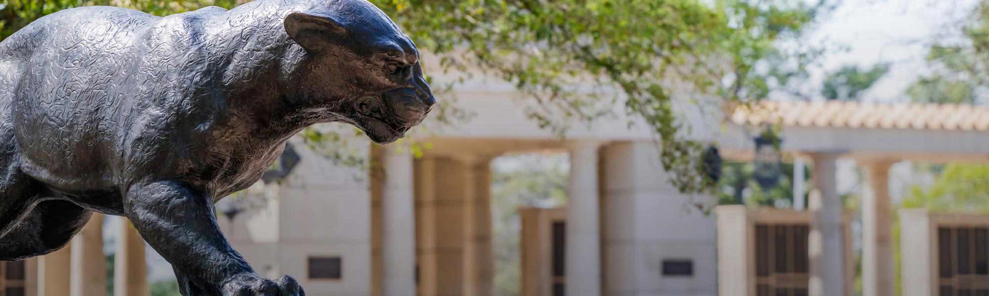 jaguar statue with alumni plaza in the background