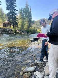 Dr. Lehrter taking data in the stream with graduate student Chris