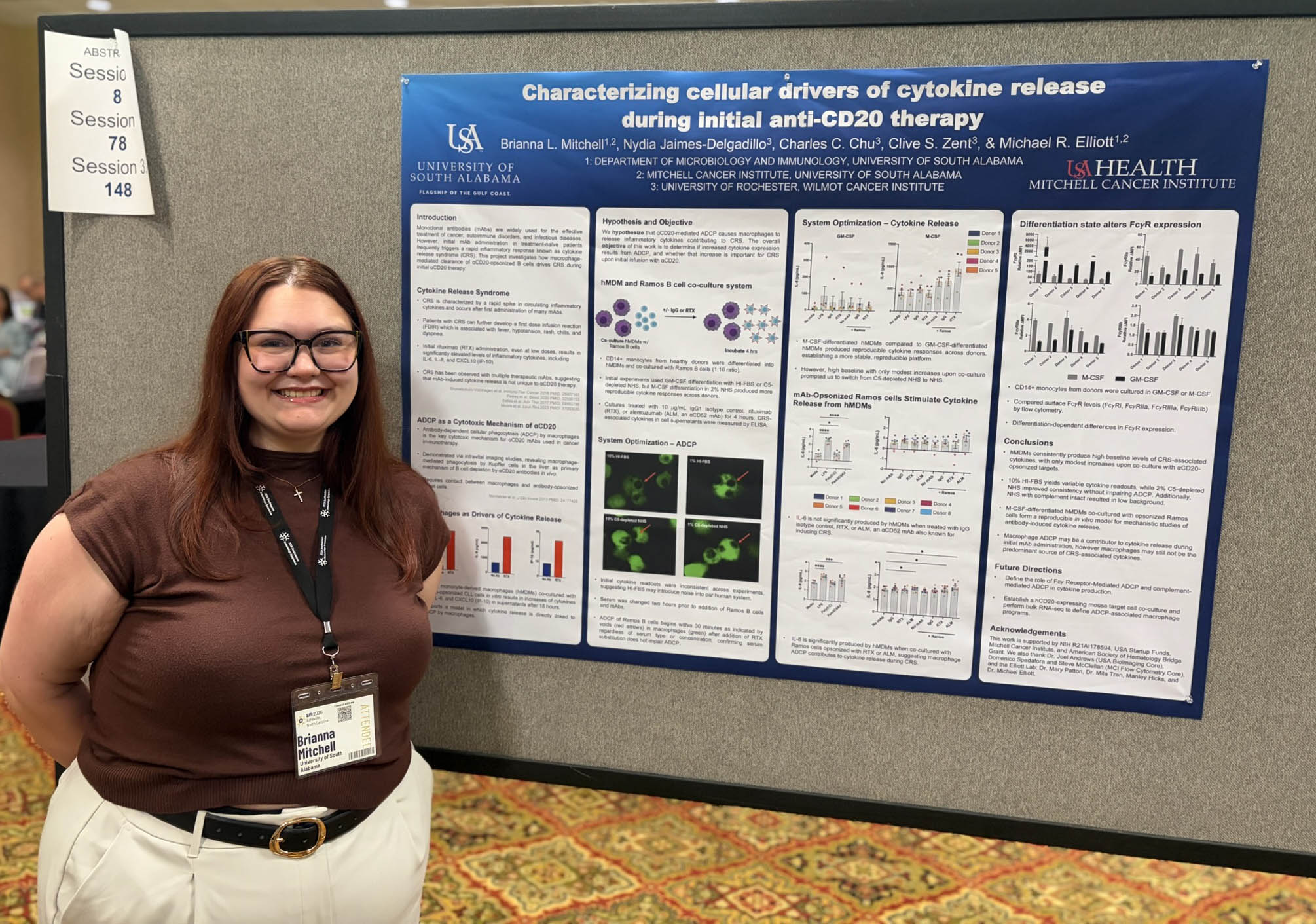Graduate student with research poster