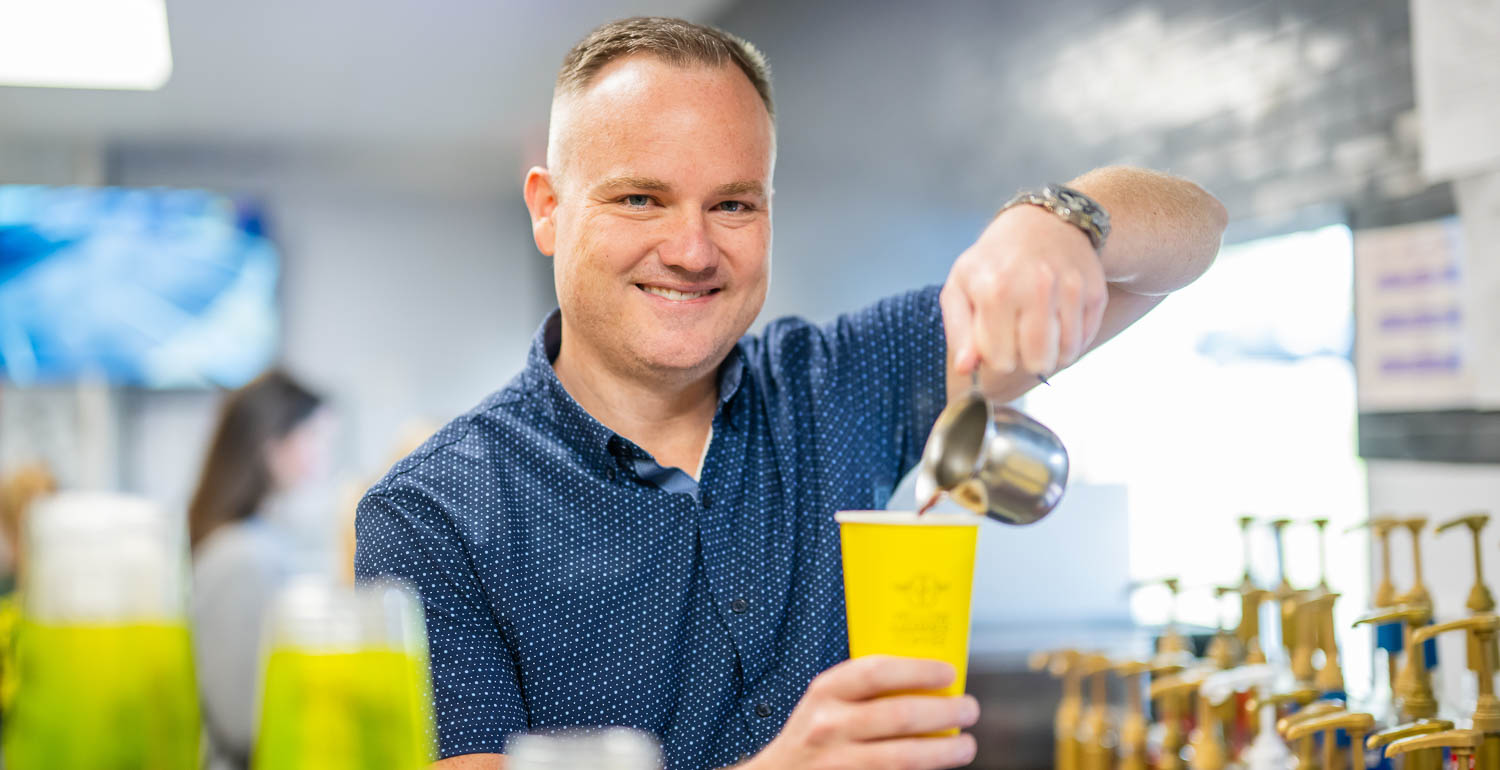 Jeff Roberts, seen here at a Yellowhammer Coffee shop, grew an idea to sell coffee out of a trailer into a local enterprise with seven locations. “Fly High, Hammer Down” has become the company philosophy.